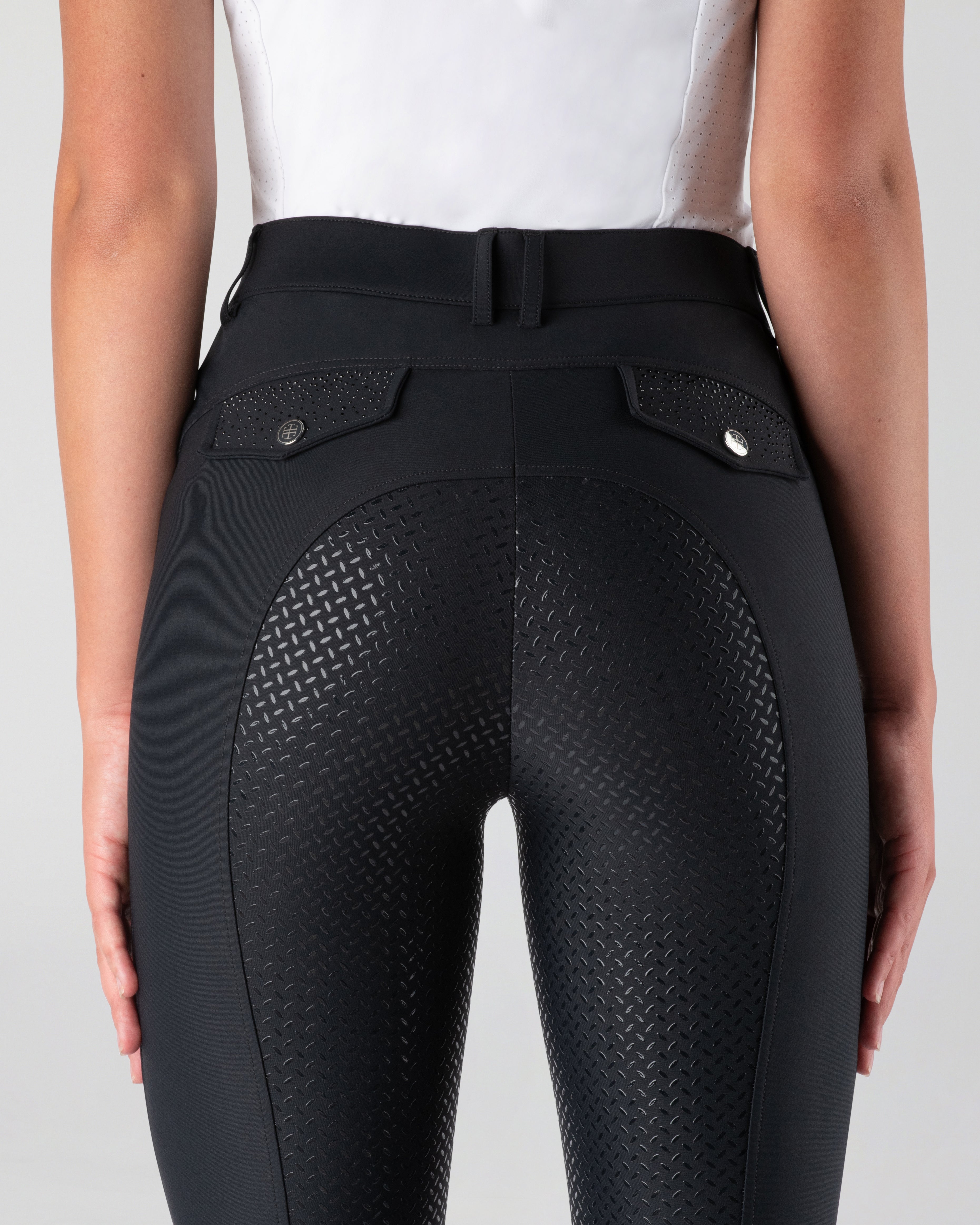 Black horse riding pants with textured design.